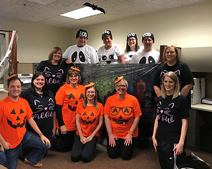 Bank of Washington employees dressed up as Jack O Lanterns and Black Cats for Halloween 2018